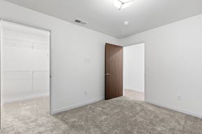 Rapid City apartment for rent - an empty bedroom with white walls and a door to a closet