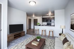 Rapid City apartment for rent - A living room with a television, a couch, and a coffee table.