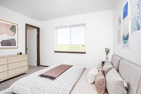 Sioux Falls apartment for rent - A bedroom with a large bed and a window.