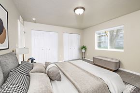 Sioux Falls apartment for rent - A bedroom with a large bed and a window.