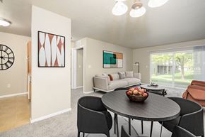 Sioux Falls apartment for rent - A modern dining room with a round table and chairs.