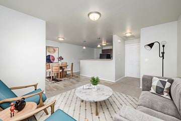 Sioux Falls apartment for rent - A living room with a grey couch and a white coffee table.