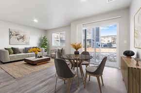 Harrisburg apartment for rent - A modern dining room with a glass table and chairs.