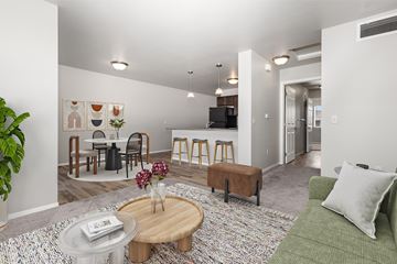 Sioux Falls apartment for rent - A living room with a green couch and a coffee table.