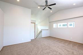 Sioux Falls apartment for rent - an empty living room with a ceiling fan and white walls