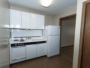 Sioux Falls apartment for rent - a kitchen with white appliances and a refrigerator
