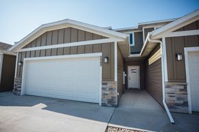 Sioux Falls townhouse for rent - a white garage door in front of a house