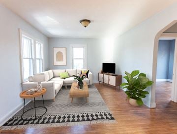 Sioux Falls apartment for rent - a living room with a white couch and a rug