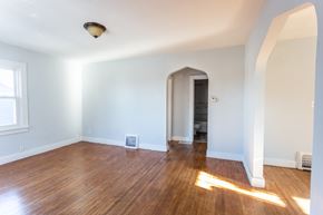 Sioux Falls apartment for rent - an empty living room with a hard wood floor and white walls