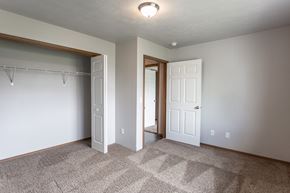 Harrisburg townhouse for rent - an empty bedroom with a closet and a door to a bathroom