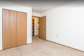 Sioux Falls apartment for rent - a bedroom with a closet and a door to a bathroom
