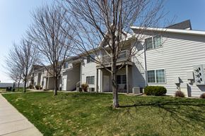 Sioux Falls apartment for rent - the residences at the crossings apartments exterior of the building with lawn and trees