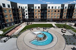 Sioux Falls apartment for rent - an aerial view of a swimming pool in front of an apartment building