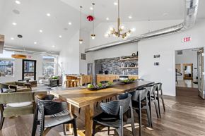 Sioux Falls apartment for rent - A modern dining room with a wooden table and chairs.
