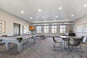 Harrisburg townhouse for rent - A room with a pool table, chairs, and a TV.