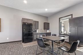 Harrisburg townhouse for rent - A modern kitchen with a dining table and chairs.