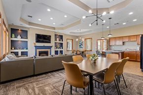 Sioux Falls townhouse for rent - A modern dining room with a large table and chairs.