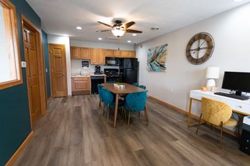 Sioux Falls townhouse for rent - a living room with a dining room table and a kitchen
