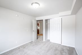 Sioux Falls apartment for rent - a bedroom with a closet and a door to a bathroom