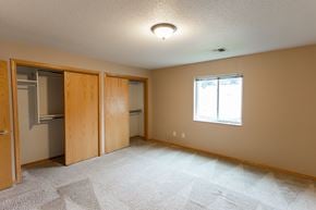 Sioux Falls apartment for rent - an empty bedroom with a closet and a window