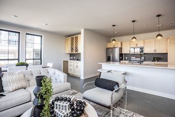 Sioux Falls apartment for rent - a living room and kitchen with couches and a table
