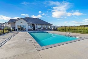 Sioux Falls townhouse for rent - A swimming pool in front of a house.