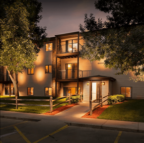 Sioux Falls apartment for rent - a city at night with lights on the side of a building