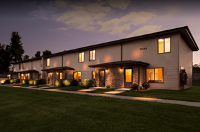 Sioux Falls apartment for rent - the exterior of a home at night with lights on in the windows