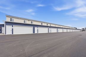Sioux Falls townhouse for rent - A long building with multiple garage doors.