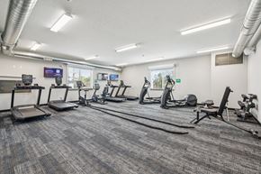 Omaha townhouse for rent - A gym with treadmills, exercise bikes, and other equipment.