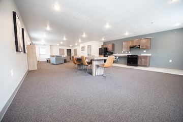 Sioux Falls apartment for rent - an open living room and kitchen with a table and chairs