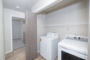 Sioux Falls apartment for rent - A small kitchen with a white oven and a white cabinet.