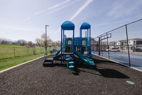 Sioux Falls townhouse for rent - A playground with a blue slide and two blue towers.