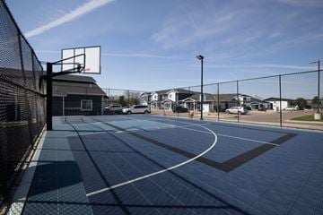 Sioux Falls townhouse for rent - A basketball court with a black fence and a basketball hoop.