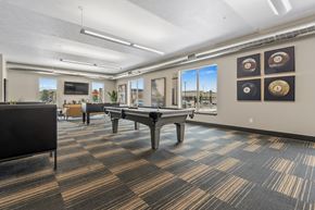 Sioux Falls townhouse for rent - A room with a pool table and a foosball table.