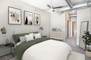 Sioux Falls apartment for rent - a bedroom with a large bed and paintings on the wall