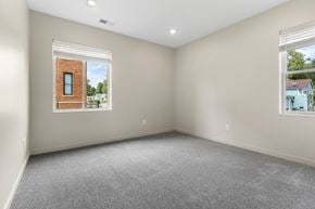 Sioux City apartment for rent - A room with a window showing a brick building outside.