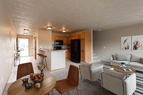 Sioux Falls townhouse for rent - a living room and kitchen with a dining table and chairs
