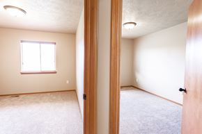 Sioux Falls townhouse for rent - the view of an empty bedroom from the doorway of a new home