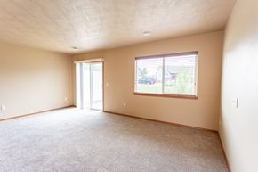 Sioux Falls townhouse for rent - the living room of an empty house with a large window