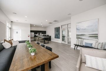 North Sioux City townhouse for rent - a living room and dining room with a wooden table