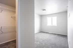Sioux Falls apartment for rent - an empty bedroom with a closet and a window
