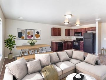 Sioux Falls townhouse for rent - a living room and kitchen with a couch and a table