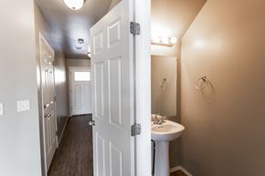 Sioux Falls townhouse for rent - a bathroom with a white sink and a white door