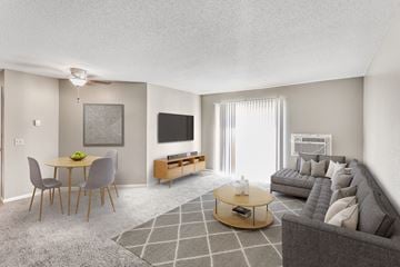 Sioux Falls apartment for rent - a living room and dining room with a couch and a table