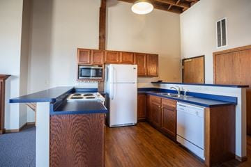 Sioux Falls apartment for rent - a kitchen with blue counter tops and a white refrigerator
