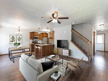 Brandon townhouse for rent - a living room with a couch and a ceiling fan
