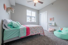 Johnston apartment for rent - a bedroom with a bed and a ceiling fan