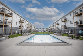 Sioux Falls apartment for rent - A swimming pool in the middle of apartment buildings.