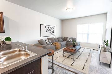 Sioux Falls apartment for rent - a living room with a couch and a table